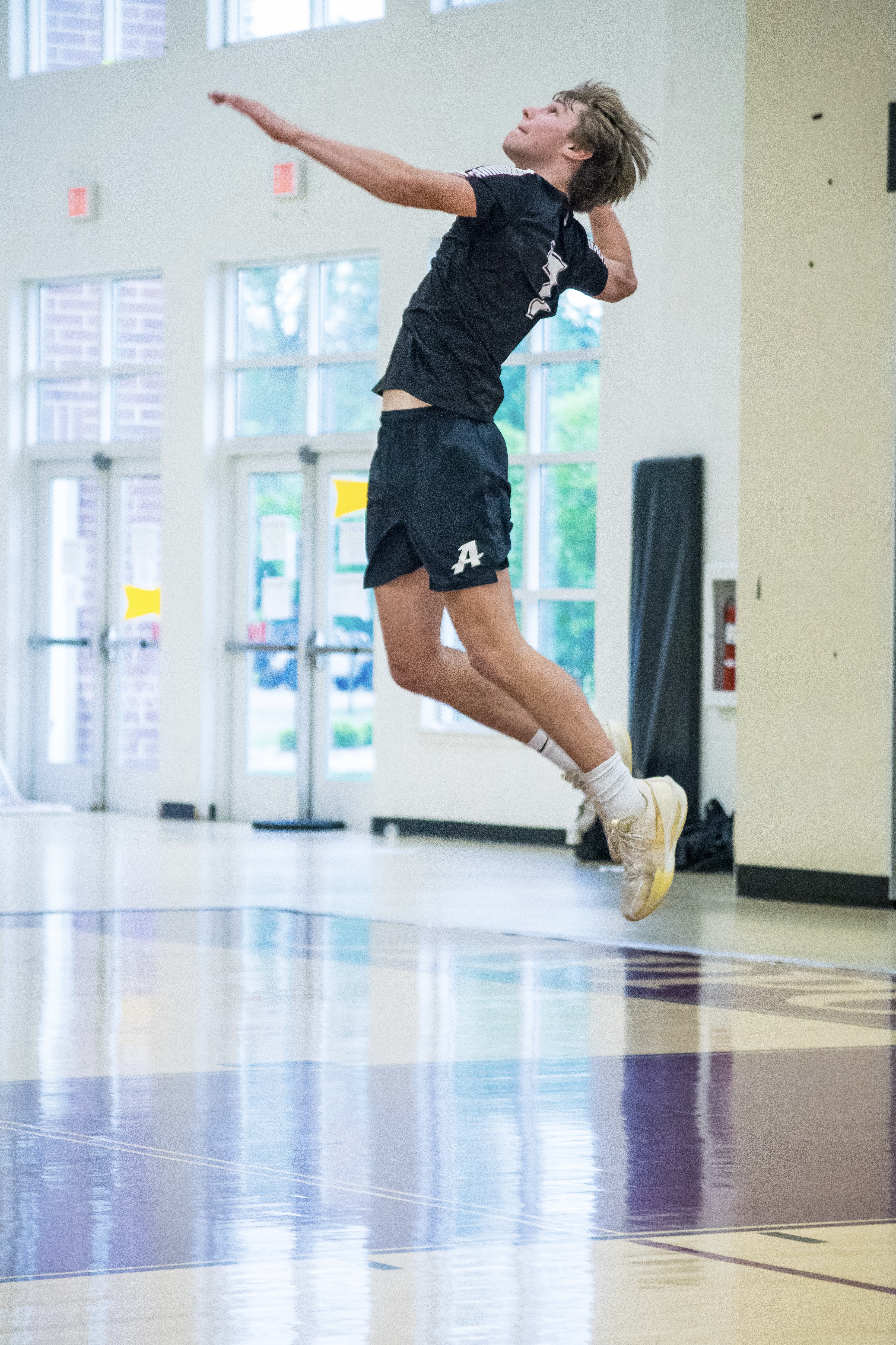 Volleyball player jumping to spike the ball