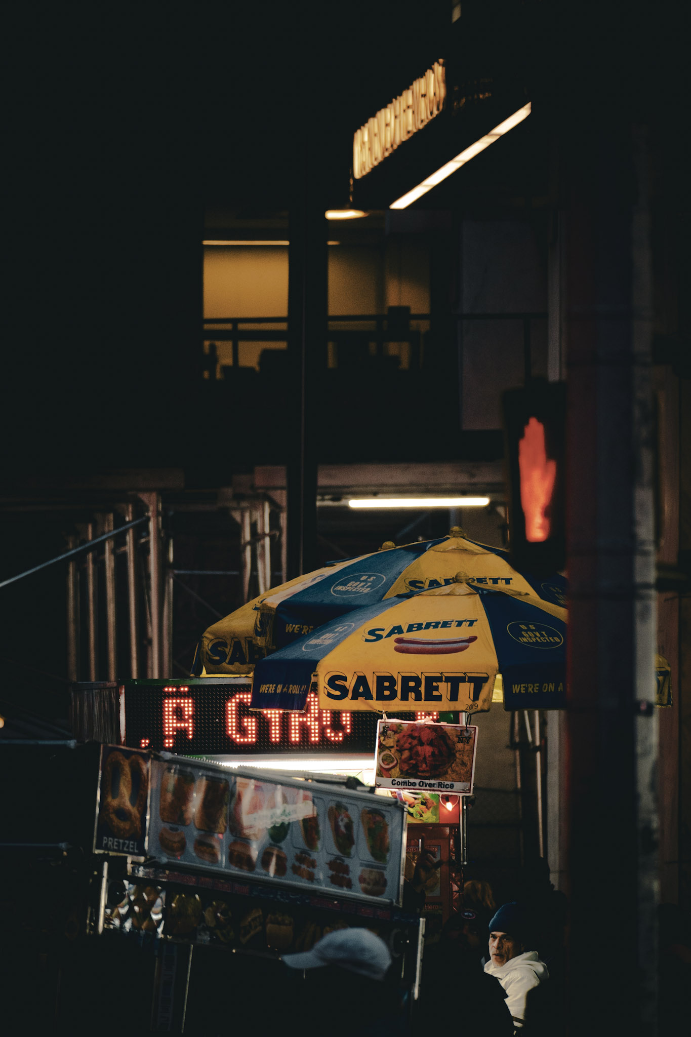 Sabrett hot dog cart on New York City street at night