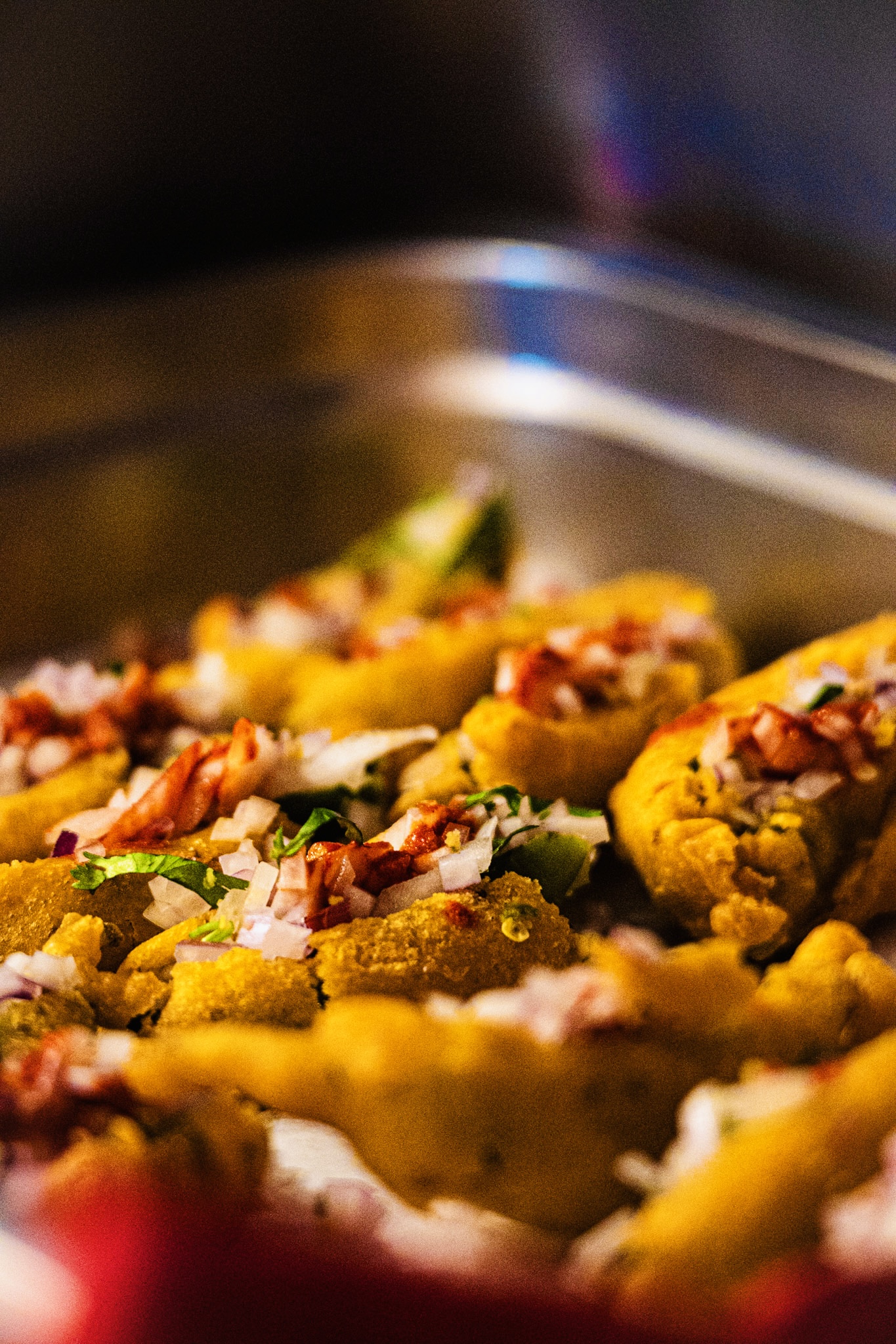 Pakora bites with onions in a steel tray — AHA South Indian Cuisine