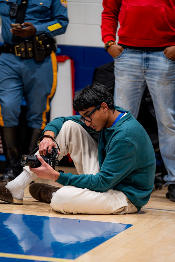 Dev Manappattu photographing courtside at a game